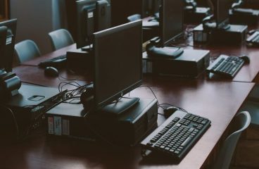 pexels photo 3747481 Spacious computer lab with rows of monitors and keyboards in a sunlit room.